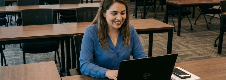Group of professionals attending a virtual insurance training session with laptops